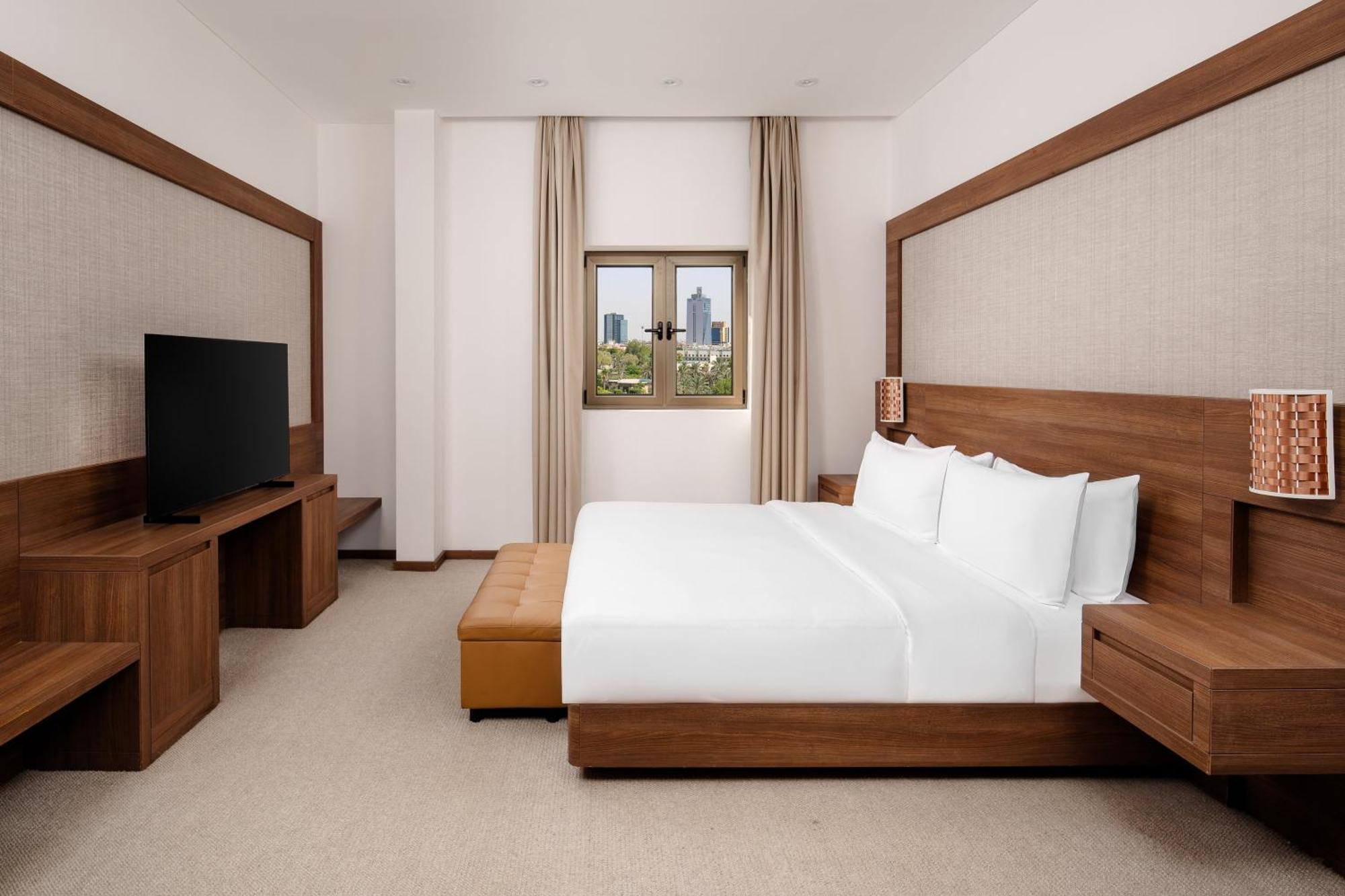โรงแรมคาร์ลตันอัลโมไอเบด ดัมมัม ภายนอก รูปภาพ A bedroom at the hotel