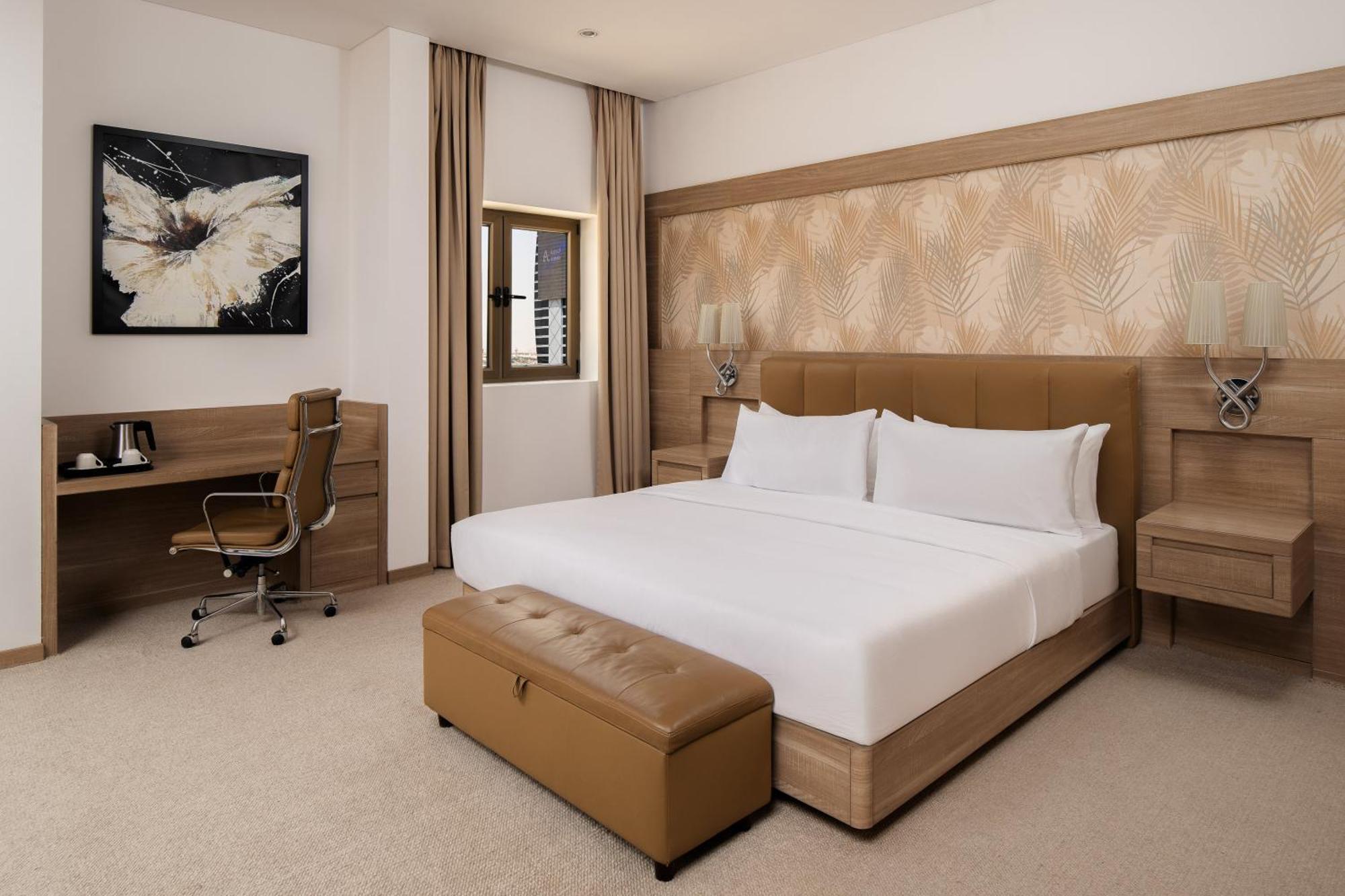 โรงแรมคาร์ลตันอัลโมไอเบด ดัมมัม ภายนอก รูปภาพ A bedroom at the hotel